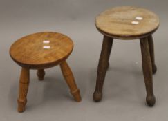 A late 19th/early 20th century elm seated stool and two others. The former 31 cm high.