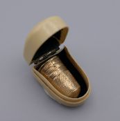 An unmarked 15 ct gold (tested) thimble. 2.25 cm high. 3.3 grammes.