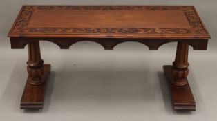 An early 20th century carved mahogany coffee table. 114 cm long.