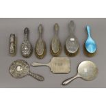 A quantity of silver backed dressing table brushes and mirrors. 52.8 troy ounces total weight.