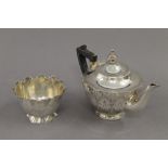 A Victorian silver sugar bowl (3.2 troy ounces) with matching unmarked white metal teapot.