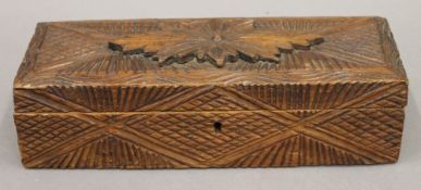 A late 19th/early 20th century carved pine box. 27 cm long.