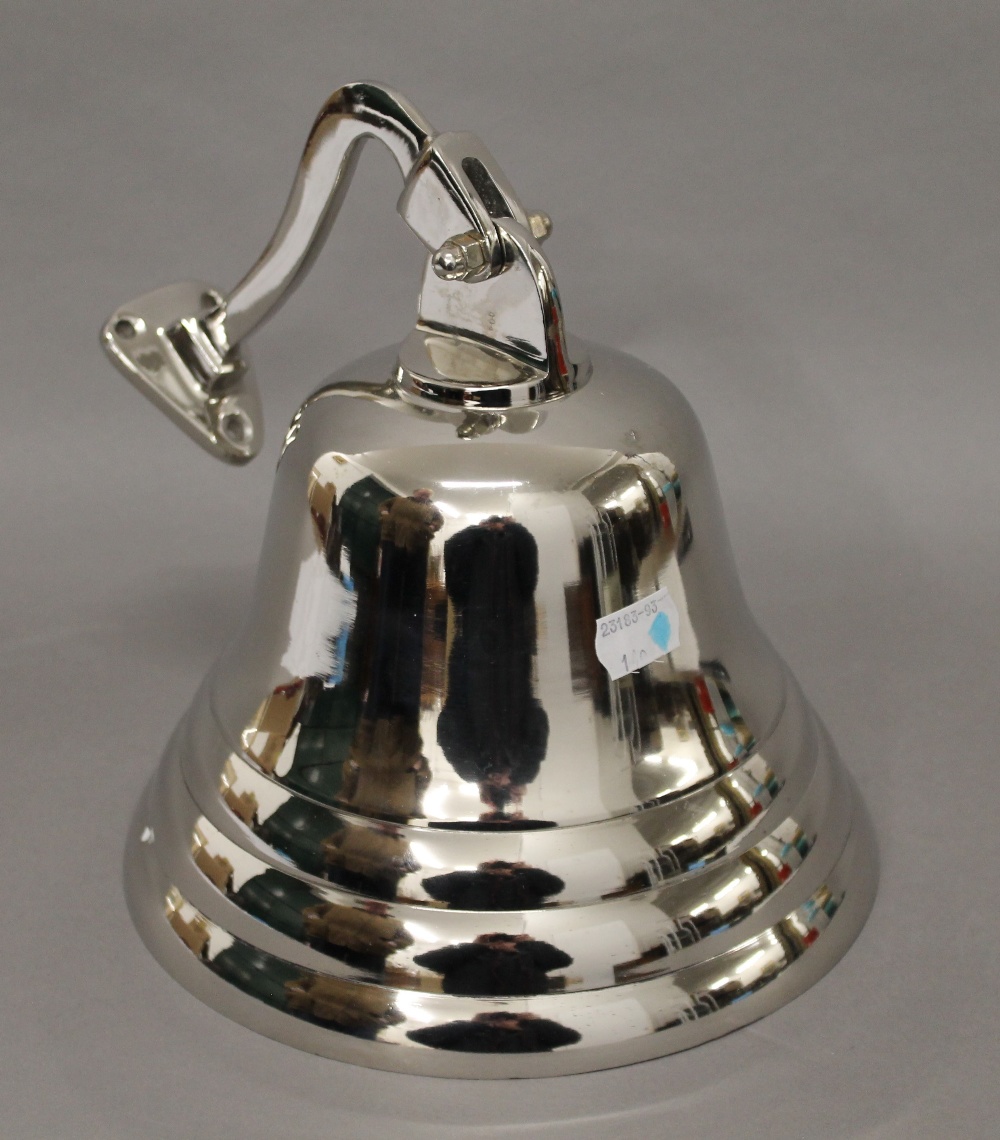 A chrome bell. 20 cm high.