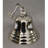 A chrome bell. 20 cm high.