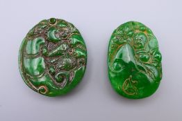 Two jade pendants. The largest 4.5 cm high.