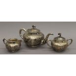 A Chinese silver three-piece tea set. The teapot 25 cm long. 30.1 troy ounces.