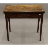 A George III mahogany fold over tea table. 81 cm wide, 40.5 cm deep, 72 cm high.