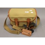 A Billingham camera and lens shoulder bag. 30 cm wide.