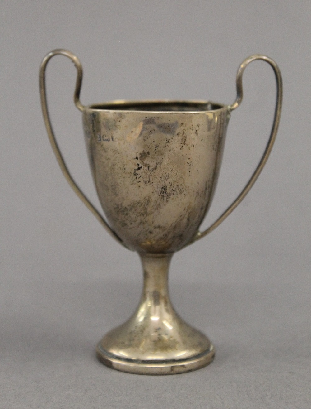 A silver bud vase, a small silver trophy cup and a broken silver trophy cup. The former 22 cm high. - Image 8 of 12