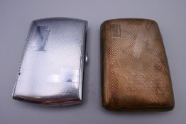 A silver cigarette case (2.7 troy ounces) and a plated cigarette case. The former 8.5 cm high.