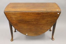 A George III mahogany oval pad foot drop leaf table. 103 cm long.