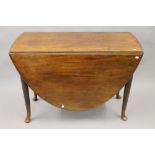 A George III mahogany oval pad foot drop leaf table. 103 cm long.