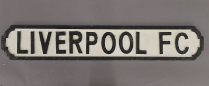 A 'Liverpool FC' wooden sign.