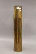 A WWII brass artillery shell. 71 cm high.