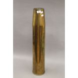 A WWII brass artillery shell. 71 cm high.