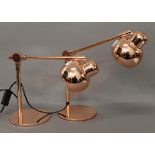 A pair of copper adjustable lamps. 38 cm high.