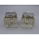 Two Art Deco silver and glass inkwells. Each 6 cm high.