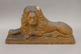 A 19th century stoneware lion. 42.5 cm wide.
