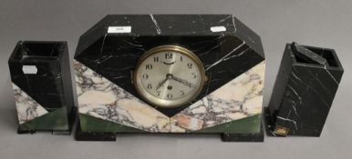 An Art Deco mantle clock garniture. The clock 22 cm high.