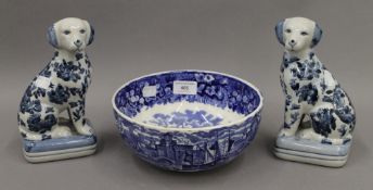 A Wedgwood bowl together with a pair of blue and white dogs