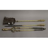 A set of 19th century brass fire irons. The shovel 68.5 cm long.