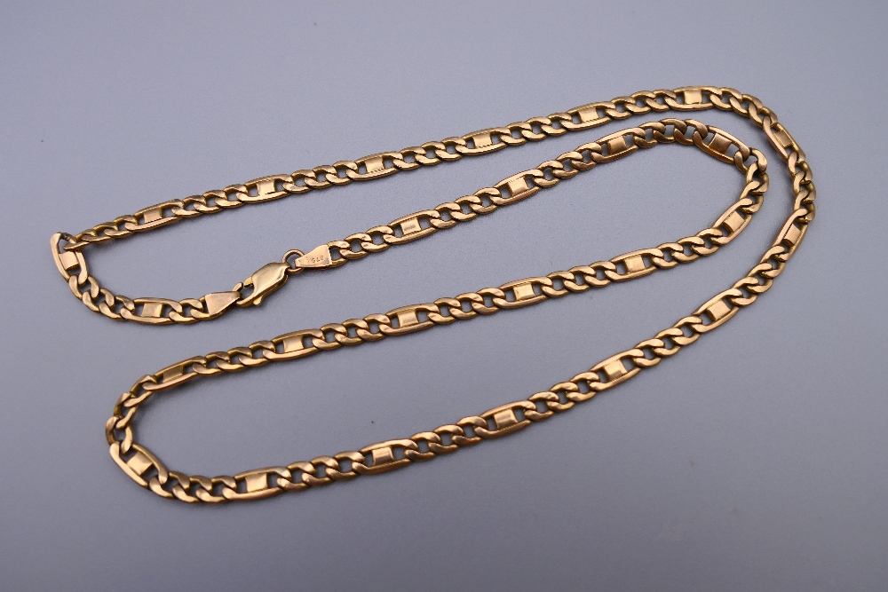 A 9 ct gold chain. 55 cm long. 23.6 grammes.