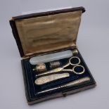 A 19th century Continental unmarked silver gilt sewing kit. 14 cm wide overall.