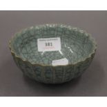 A Chinese crackle glaze bowl with incised mark to base. 12.5 cm diameter.