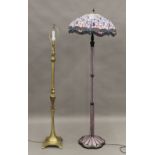 A Tiffany style standard lamp and a brass standard lamp. The former 168 cm high.