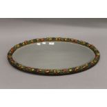 A vintage barbola type oval wall glass. 65 cm wide.