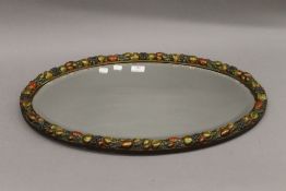 A vintage barbola type oval wall glass. 65 cm wide.