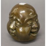 A four face Buddha head. 11 cm high.