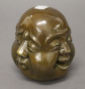 A four face Buddha head. 11 cm high.