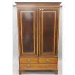 An Edwardian strung and crossbanded mahogany double wardrobe.