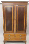 An Edwardian strung and crossbanded mahogany double wardrobe.