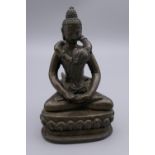 A bronze erotic Buddha figure. 11.