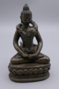 A bronze erotic Buddha figure. 11.