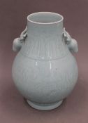 A Chinese blue vase with stag head handles. 29.5 cm high.