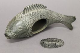 A Chinese bronze fish censer. 23 cm long.