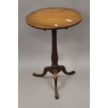 A George III mahogany tilt top tripod table. 47 cm diameter.