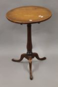 A George III mahogany tilt top tripod table. 47 cm diameter.