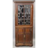 A Victorian mahogany corner cupboard. 199 cm high.