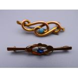 An unmarked gold turquoise set brooch and a 9 ct gold brooch. The former 4 cm wide. 3.