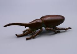 A bronze model of a beetle. 8 cm long.