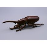 A bronze model of a beetle. 8 cm long.