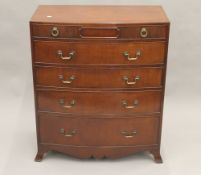 A modern 19th century style bow front chest of drawers. 88.5 cm wide.