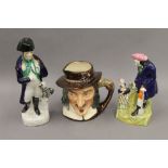 Two Royal Doulton character jugs together with two Staffordshire figures. The largest 28 cm high.