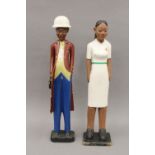 Two African painted wooden figures: one male and one female. The latter 61 cm high.