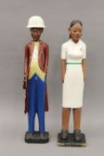 Two African painted wooden figures: one male and one female. The latter 61 cm high.