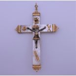 An unmarked high carat gold mounted mother-of-pearl crucifix form pendant. 10 cm high.